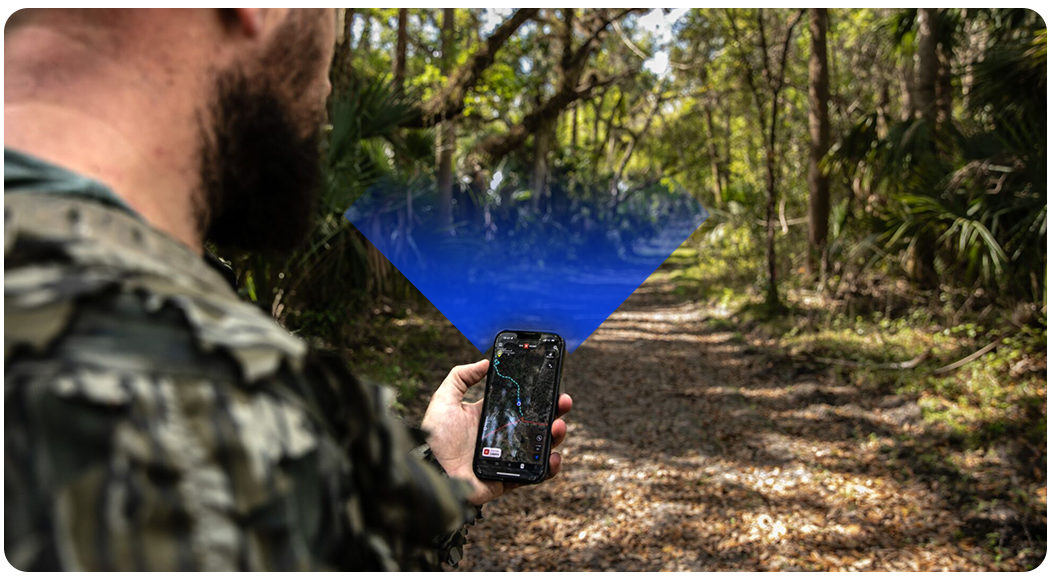 A man using onX Hunt on his phone with a graphic showing the degree of certain you can get with GPS 