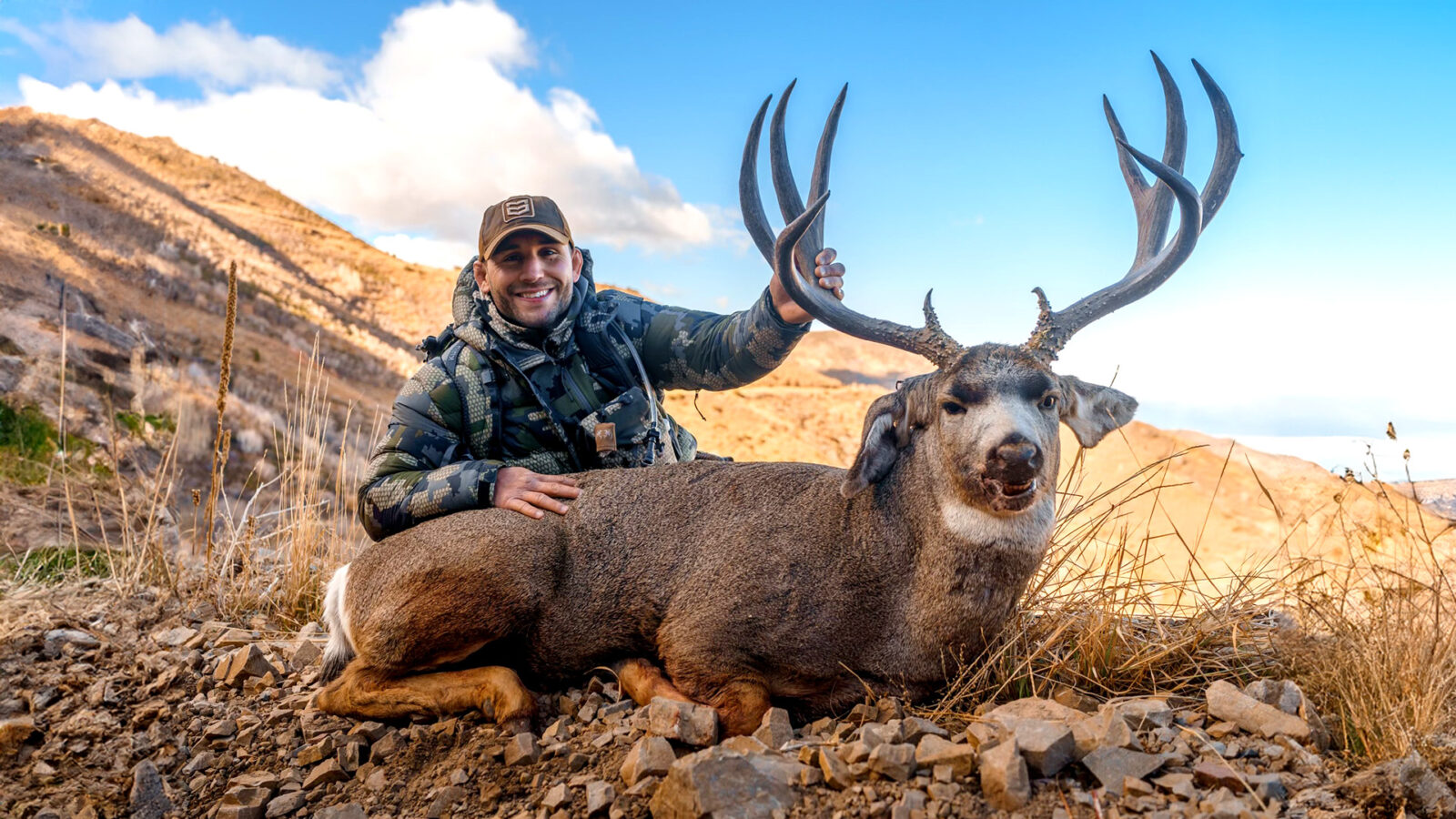 chad mendes with a bull elk he harvested