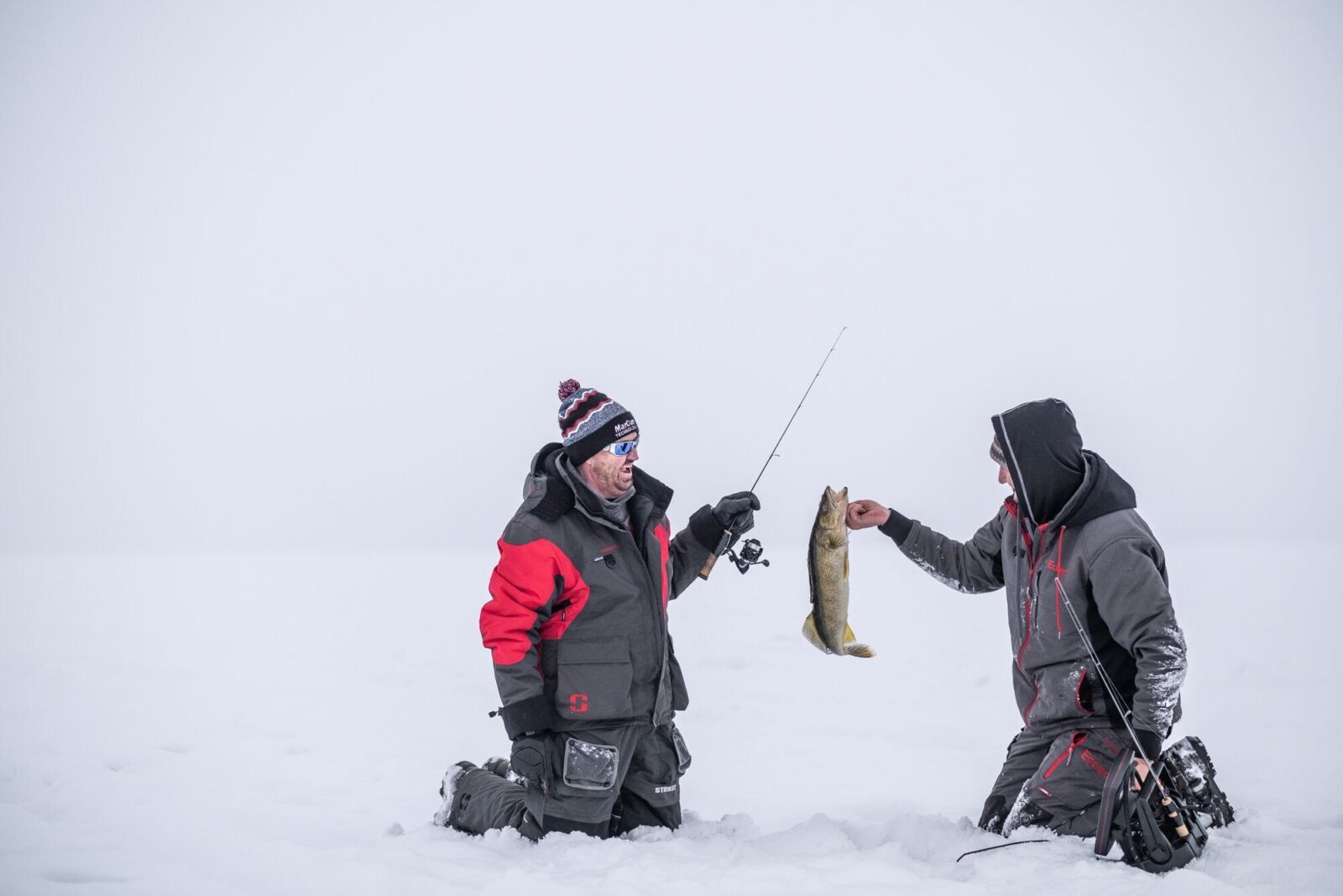 Two fisherman ice fishing for walleye